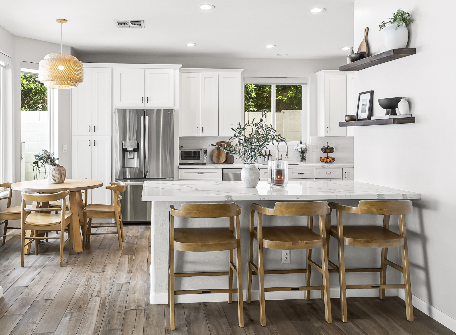 Beautifully reimagined 3-bedroom, 2-bath patio home in the gated Belmont at Triple Crown community--where timeless character meets modern living. Spanning 1,659 square feet, this home has been fully updated from top to bottom--offering the feel of new construction with the solid bones of an established home. Recent improvements include a new roof, all-new windows, and a complete interior renovation featuring custom cabinetry, quartz countertops, wood-look tile flooring, and thoughtfully selected modern finishes throughout. The redesigned kitchen is both functional and stylish, showcasing new cabinetry, quartz surfaces, and high end appliances--perfect for everyday living or entertaining. The primary suite offers a spa-like experience with custom tile work, dual shower heads + vanities, while both bathrooms feature fully updated finishes for a cohesive, elevated look. Step outside to a private backyard retreat, framed by lush green hedge walls for added privacy. Designed for easy living, the space includes turf, travertine pavers, a spacious covered patio, and a built-in outdoor kitchen. Residents of Belmont enjoy gated entry, a community pool ideal for lounging or laps, a spa, and a fitness room for a convenient workout close to home. Ideally located just minutes from the Mayo Clinic, Desert Ridge, High Street, and Kierland, this home offers effortless access to some of North Scottsdale's best dining, shopping, and lifestyle amenities--perfect for both full-time residents and lock-and-leave buyers alike. Turnkey, impeccably upgraded, and perfectly positioned--this is easy Scottsdale living at its finest.