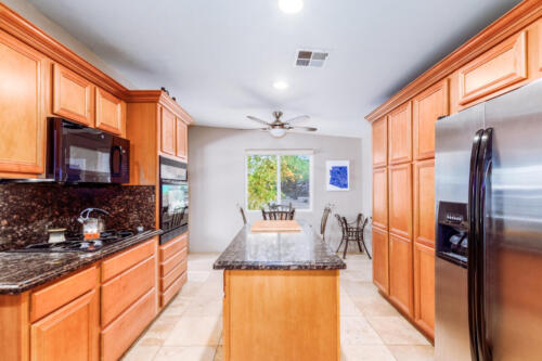 Updated Kitchen with Gas Range, Granite Countertops & Tons of Storage.